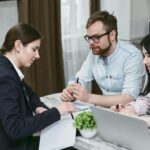 Image of a family reviewing home financing documents together in their living room.